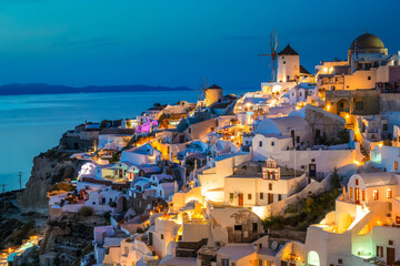 lights of Oia village at blue night, Santorini Greece