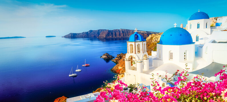 Fototapeta white church belfry and volcano caldera with sea landscape, beautiful details of Santorini island, Greece, banner