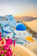 traditional greek village Oia of Santorini, with blue domes of churches and village roofs, Greece