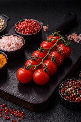 Red cherry tomatoes on a branch, a vegetable as an ingredient for making sauces