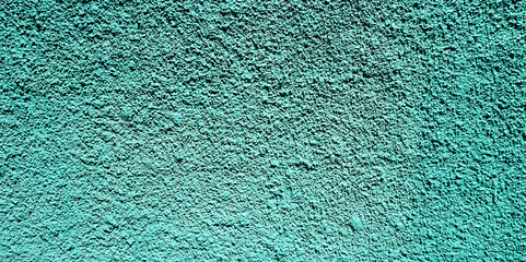 Turquoise blue plastered volcanic stone wall abstract background texture for design.Banner with copy space.