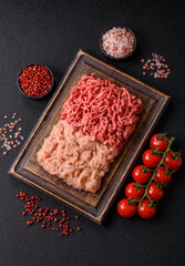 Beef and chicken minced meat, ground of two types fresh raw with salt and spices