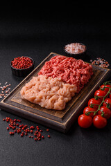 Beef and chicken minced meat, ground of two types fresh raw with salt and spices