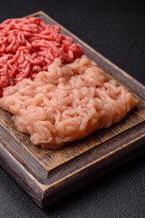 Beef and chicken minced meat, ground of two types fresh raw with salt and spices