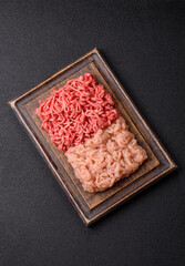Beef and chicken minced meat, ground of two types fresh raw with salt and spices