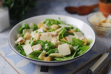 A bowl with classic Caesar salad
