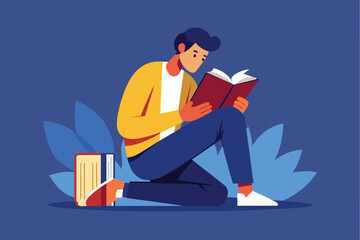 A young individual is kneeling on a surface, deeply immersed in reading a book, with a stack of books resting beside them and lush blue leaves in the background.
