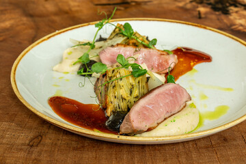 Sous-vide duck breast with root vegetables and creamy puree
