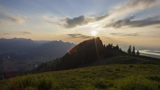 Mountain Zwoelferspitz with sunset at lake Chiemsee in Bavaria, Germany, 4K