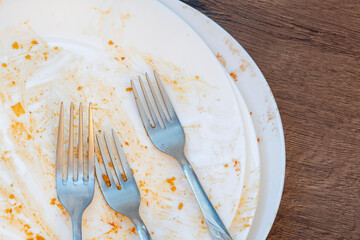 dirty plates after eating. Cutlery. forks on a plate. Dirty dishes after eating. End of meal