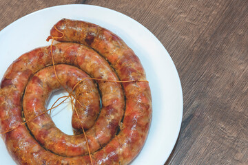 baked sausage. Homemade Pork sausage. Homemade sausage on the plate