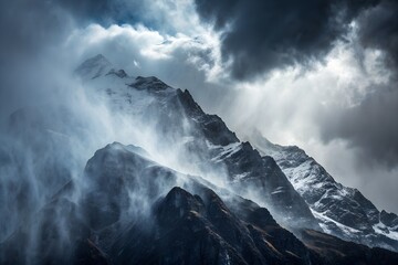 Obraz premium A dramatic mountain scene with a heavy rainstorm, mist swirling around the peaks, dark, moody clouds 