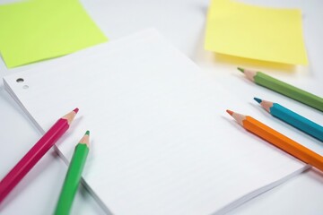 White background, pencils & notepad, sharp focus , paper, design