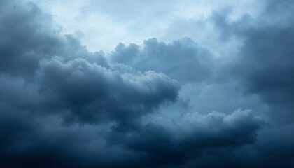 Stormy Sky: A dramatic and moody sky filled with ominous, swirling clouds. The deep blue hues and threatening atmosphere create a sense of impending change and raw power.  