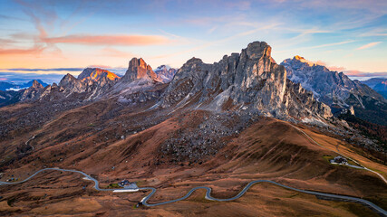 The Passo di Giau mountain pass in the Italian Dolomites. Panoramic view of Passo di Giau at sunrise in autumn. View of the Ra Gusela mountain.