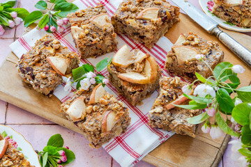 Home baked rolled oats, carrots, apples and walnuts flapjack for healthy breakfast