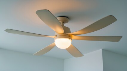 Three-blade cream color contemporary ceiling fan in the room.