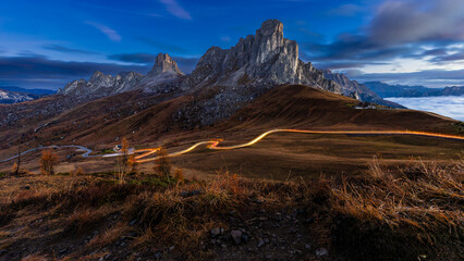 The mountain pass Passo di Giau in the blue hour before sunrise. A mountain massif in the Italian...