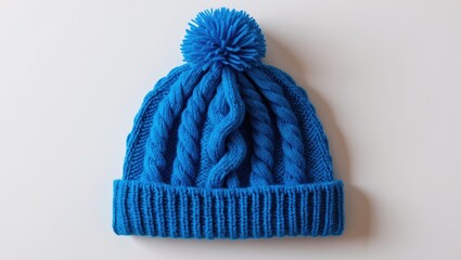 Knitted wool hat in blue color set on a white background