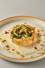 Elegant Salmon Spinach Roulade with Pistachio Garnish in Neutral Tones