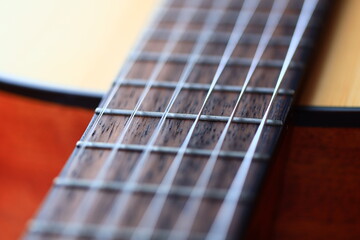 A detailed look at the frets on a guitar, ideal for music-related uses.