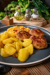 Meatballs  served with fired potatoes.