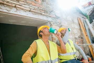 Two workers taking a break at construction site