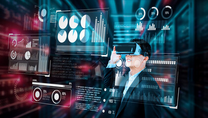 Businessman with headset standing at data center while analyzing financial data. Manager looking marketing statistic hologram and using augmented reality goggles while making a decision. Ingenuity.