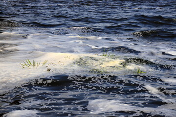 Dirty foam in wastewater, sewerage. Water pollution, wastewater treatment. bad ecology