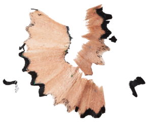 Curled black pencil shaving on isolated background. Close up