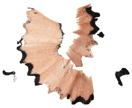 Curled black pencil shaving on isolated background. Close up