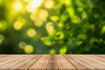 Wood table top on blurred green background - can be used for montage or display your products