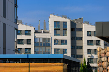 Cityscape on a summer day, modern buildings and houses 
