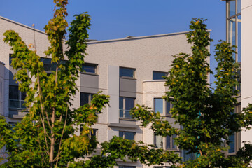 Cityscape on a summer day, modern buildings and houses 