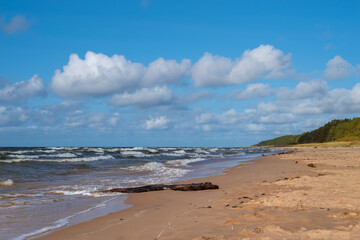 Beautiful landscape - sunny day on the empty beach. High waves on Baltic sea, Salacgriva, Latvia.