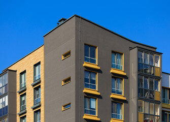 Obraz premium Cityscape on a sunny day, modern buildings and houses 