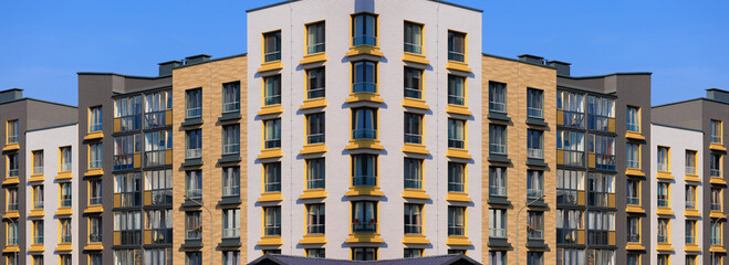 Cityscape on a sunny day, modern buildings and houses 