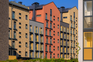 City view on a sunny day. Modern houses against the blue sky.