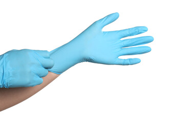 Doctor putting on medical gloves against white background, closeup