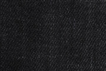 Texture of black denim fabric as background, top view