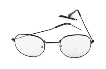 Eyeglasses with broken lens and temple isolated on white