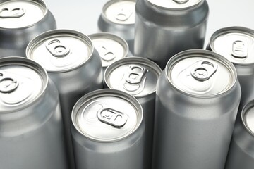 Many different tin cans on light background, closeup