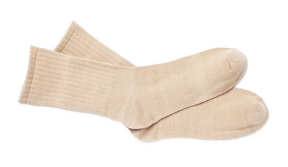 Pair of beige socks isolated on white, top view