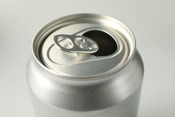 One open tin can on white background, closeup