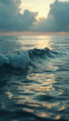 Ocean Wave at Dusk: A Tranquil Scene of Water, Light, and Clouds