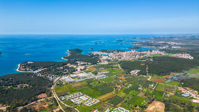 Aerial photo of the stunning Limski Kanal and Camping Koversada near Vrsar, Croatia. The landscape features lush greenery, crystal-clear turquoise waters, and winding coastline &mdash; a true Adriatic