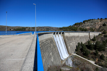 Dam releasing water in this case the one that dams the Aceña River that gives its name to the aforementioned dam in the Community of Madrid, Spain.