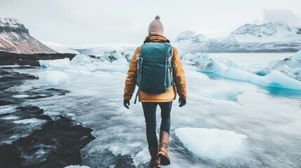 Woman hikes icy glacial landscape, mountains background, adventure travel