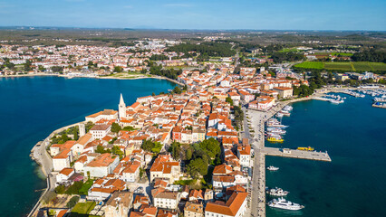 Aerial view of Poreč (Porec), Croatia, showcasing the charming old town, vibrant coastline, and...