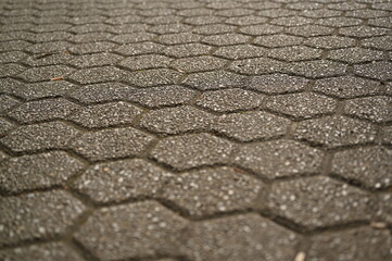 pentagonal grey paving tile texture, grey tile pattern as background, grey tile texture close up	
 tiles as a background in the old town, grey tiles